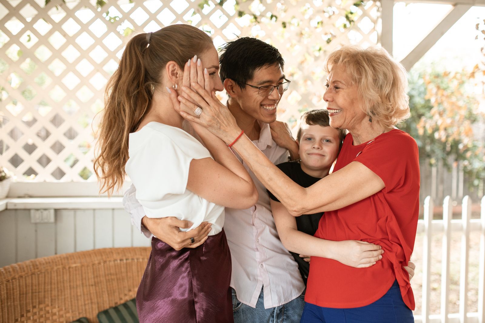 Three generations of a family hugging